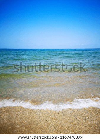 Summer beach and soft wave past. Sand and sea