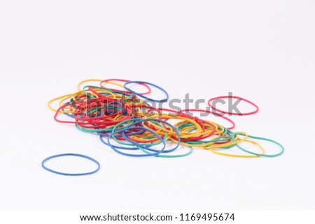 Multicolored elastic bands on a white background