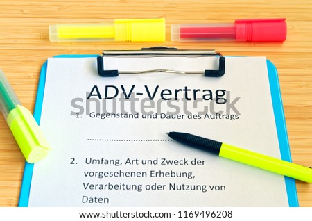 Clipboard with a contract and inscription in german ADV-Vertrag in english ADV contract and subject matter and duration of the contract and scope type and purpose of the proposed survey