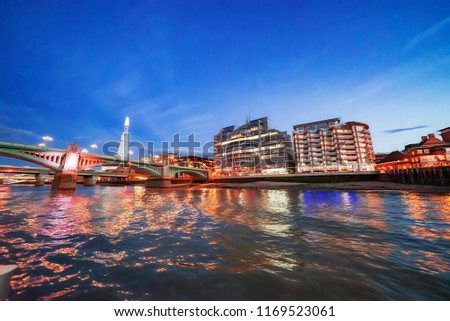 Twilight London River Thames scene from a boat journey along the River