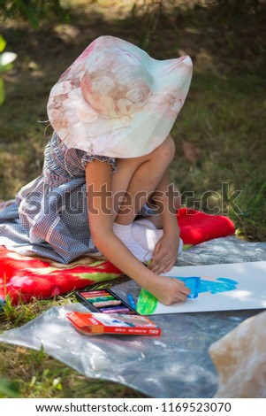 girl drawing in the park