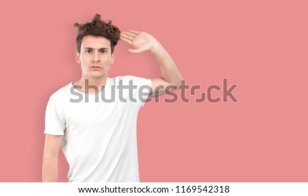 Young guy doing an angry gesture