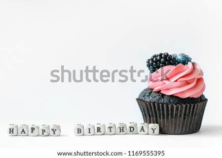 Chocolate cake with cream berries and candle