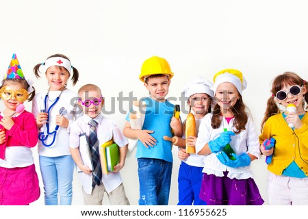 Group of seven children dressing up as professions Royalty-Free Stock Photo #116955625