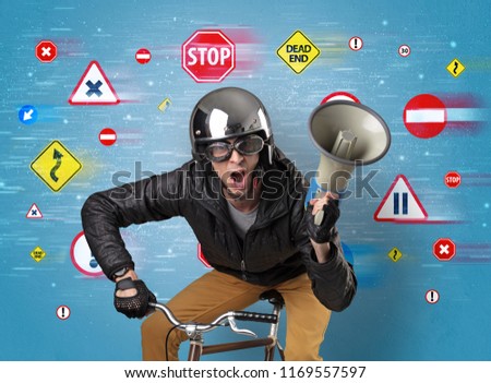 Young guy with stylish outlook and highway code on the background