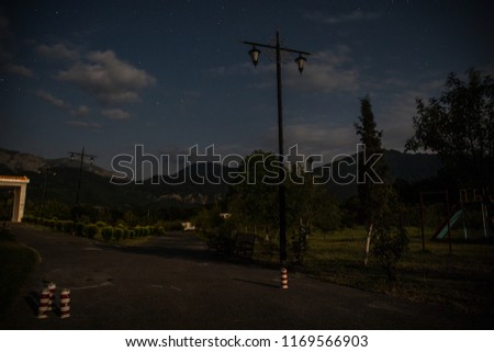 Beautiful view of street lamp in the starry night. Street lamp at night