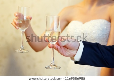glasses in hands close-up. holiday, wedding