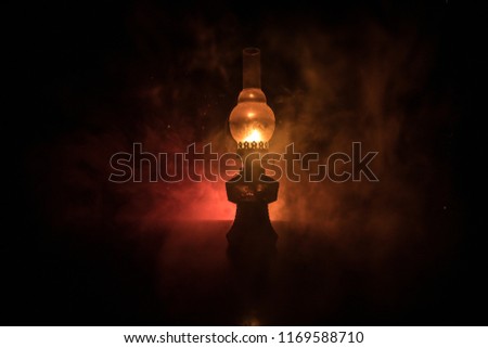 Oil Lamp Lighting up the Darkness or Burning kerosene lamp background, concept lighting