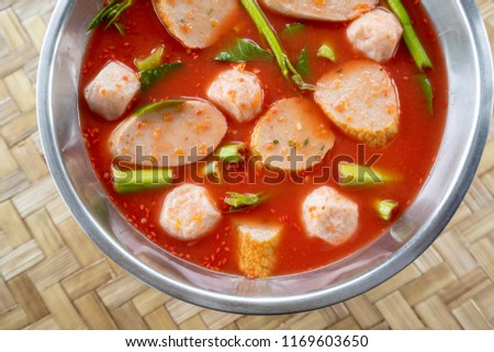 Image of Thai food,Pink seafood ( fish ball) , morning glory with soup(Yen ta fo) hot pot.