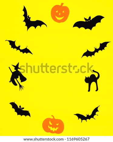 Happy Halloween. Pumpkins and bats on yellow background.