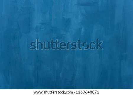 Blue texture. A dark blue wall. Blue putty on the wall
