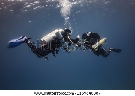 Tec divers doing last decompression stop Royalty-Free Stock Photo #1169648887