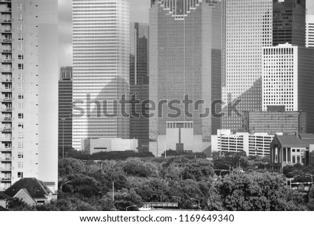 Tall skyscrapers crowd around park space in Houston, Texas.