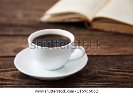 Cup of coffee on a wooden table Royalty-Free Stock Photo #116966062