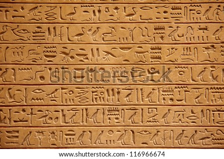Egyptian hieroglyphics on the stone wall Royalty-Free Stock Photo #116966674