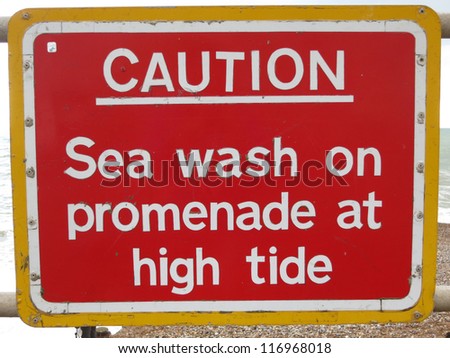 Warning Sign for Sea Wash on Promenade