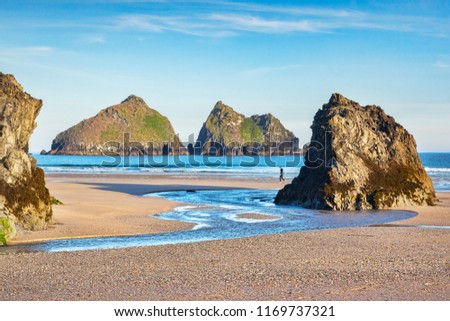 Rocks on Holywell Beach, with a view through  to Carters Rocks, Cornwall, UK Royalty-Free Stock Photo #1169737321