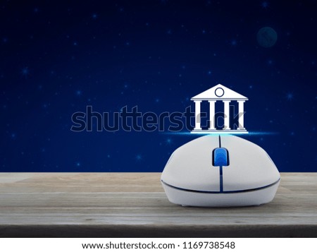 Bank icon with wireless computer mouse on wooden table over fantasy night sky and moon, Business banking online concept