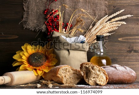 Rye bread on wooden table on wooden background