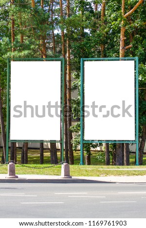Mock up of two blank billboard, outdoors advertising boards in the city park