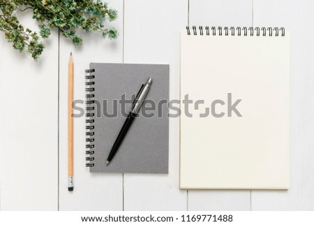 Top view, Office desk mock up template with wood table, notebook, pen and pencil. View from above with copy space