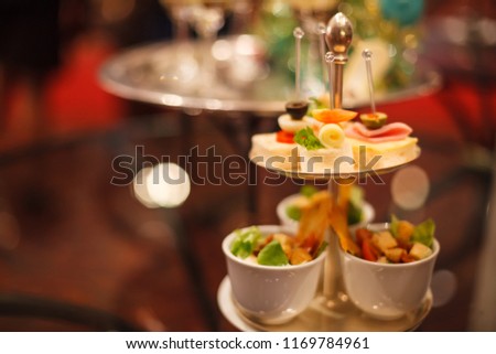 Canapes Assortment on silver tray on table background. Hotel venue restaurant food catering service buffet, cocktail banquet for wedding ceremonies, seminars, meetings, conferences, parties or events