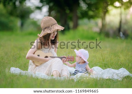 mother and daughter are happy moment in the garden.mother day holiday concept