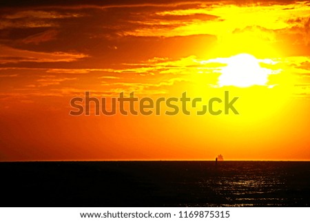 scenic seascape when sun setting behind cloudy sky over sea horizon before sunset in minimal style so artistic outdoor pattern for awesome nature background