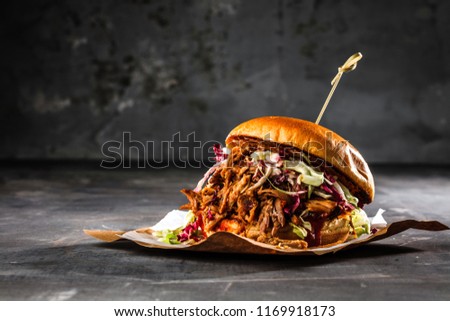 homemade pulled pork burger with bbq sauce Royalty-Free Stock Photo #1169918173