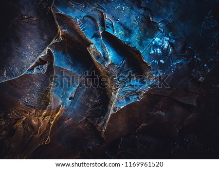 Rock texture. Dark stone wall. Stone background. Rock surface with holography and nacre. Fantasy wallpaper Royalty-Free Stock Photo #1169961520