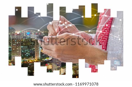 Double exposure of business  Arab man writing on smart phone screen,night city scape and network sign background,selective focus.