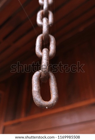 Close Chain isolated on brown background