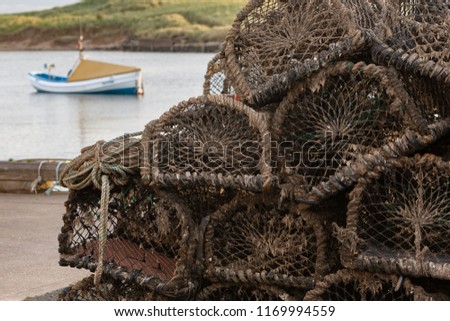 Detail of lobster traps stacked in a harbour. Fishing concept