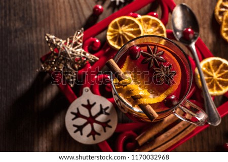 Two glasses of hot mulled wine with christmas decoration