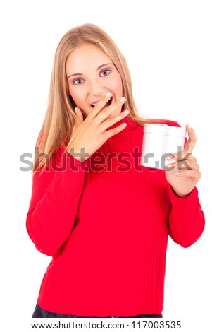 Happy young woman holding a gift, isolated over white