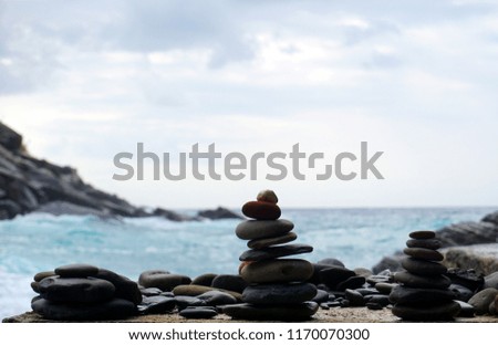 Close-up wallpaper of rock balance at a cave entry in Vernazza, Cinque Terre, Italy.