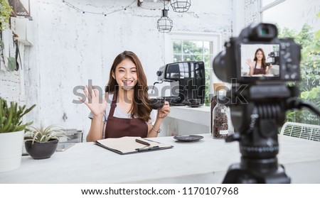 Startup successful small business owner sme beauty vlogger girl video online marketing camera in cafe. Portrait young asian woman barista cafe owner. SME entrepreneur blogger online business concept Royalty-Free Stock Photo #1170107968