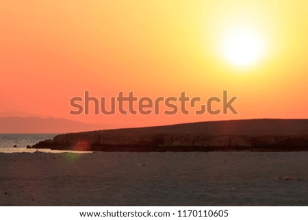 Sunset orange and red colors landscape, sea and sun with deep sky background.
 