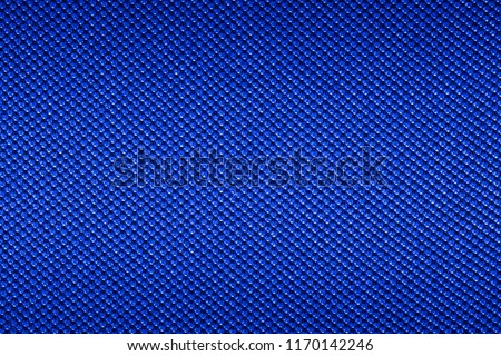 Blue texture of synthetic fabric. Textile background.