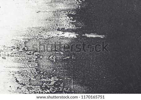 Abstract black and white ink painting on grunge paper texture - artistic stylish background. Artistic wallpaper for design.