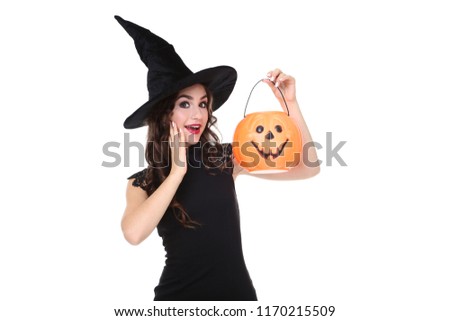 Young woman in halloween costume with pumpkin bucket isolated on white background