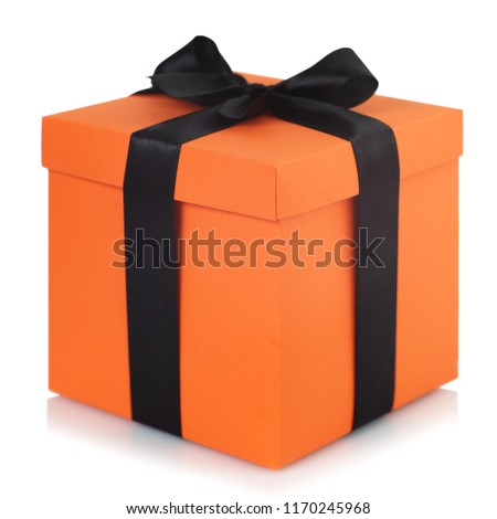Decorated black and orange halloween gift box isolated on white background with reflection Royalty-Free Stock Photo #1170245968