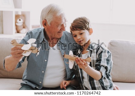 Portrait Grandpa and Grandson Playing with Toys. Family Relationship Between Grandfather and Grandson. Grandpa Teaching, Male Grandchild, Learning Concept. Relations and People Concept. Royalty-Free Stock Photo #1170264742