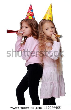 Cute two friends with toy horns isolated on white background on Holiday theme/Lovely joyful kids