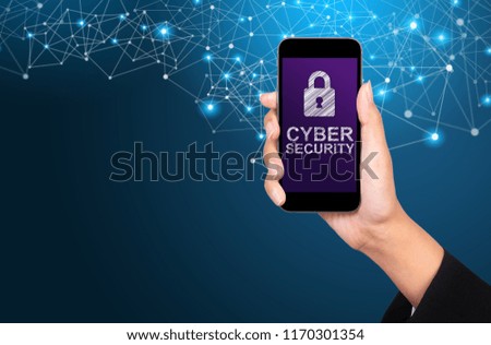 Cyber security concept. Cyber security on smartphone screen in businesswoman hand.