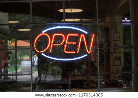 Open Neon sign in a window