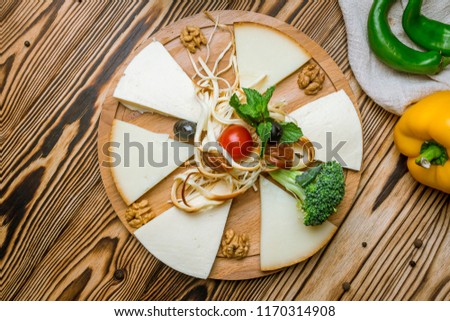 Suluguni cheese sliced on a plate