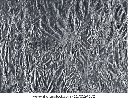 Shiny gray silver aluminum crumpled wrapping paper foil texture for wallpaper decoration element background, stock photo image