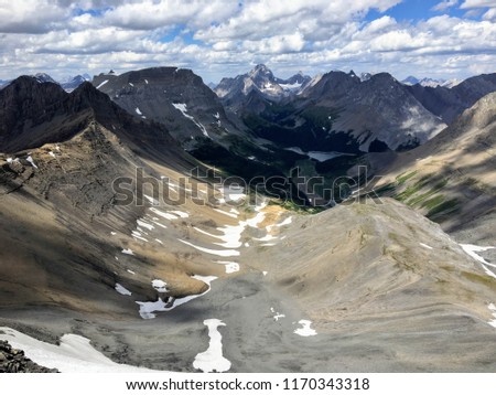 A view of a beautiful valley surrounded by the Rocky mountains Backcountry hiking the spectacular Northover Ridge trail in Kananaskis, Alberta, Canada