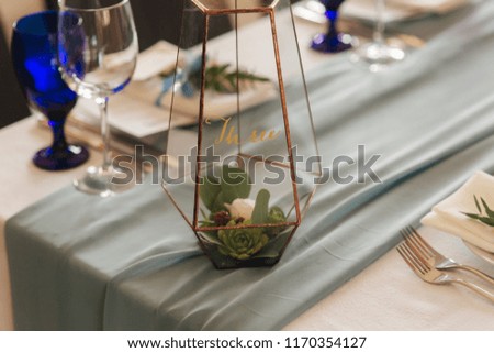 Elements of wedding decoration in restaurant. Green and blue color